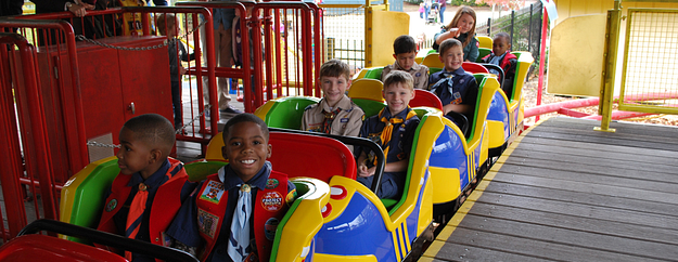 Scouts riding a roller coaster at Wild Adventures
